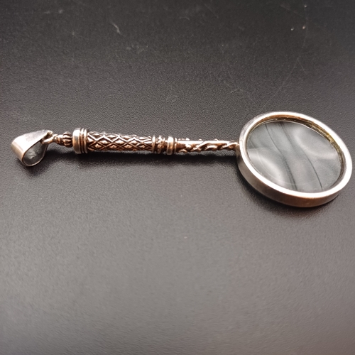 38 - Magnifying Glass Pendant set in 925 Silver with very pretty design down the handle.  This is a reall... 