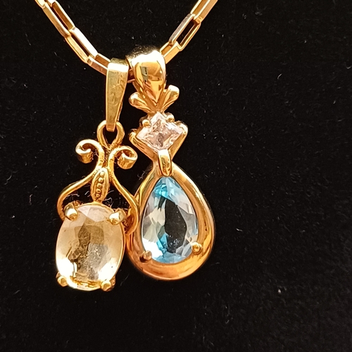 39 - Really pretty 18 inch 9 ct Gold Chain with two pendants:
1 x Pendant with a Blue Stone (Topaz or Sap... 