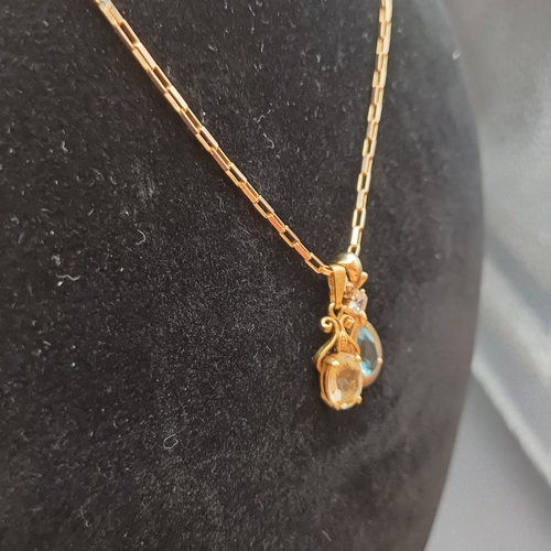 39 - Really pretty 18 inch 9 ct Gold Chain with two pendants:
1 x Pendant with a Blue Stone (Topaz or Sap... 