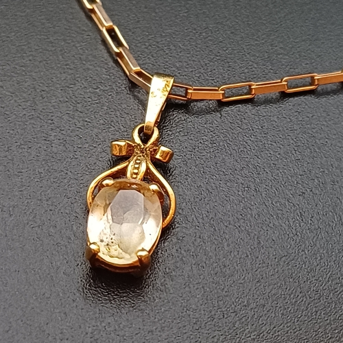 39 - Really pretty 18 inch 9 ct Gold Chain with two pendants:
1 x Pendant with a Blue Stone (Topaz or Sap... 