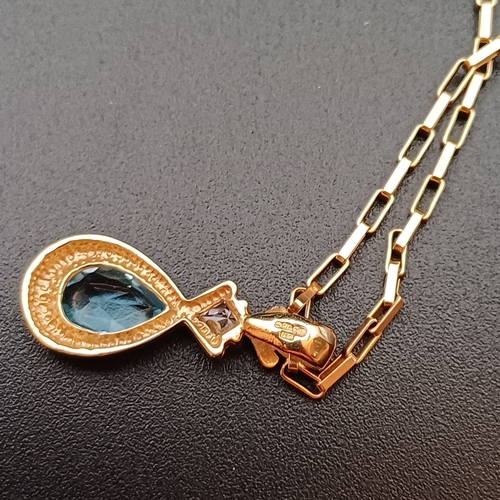 39 - Really pretty 18 inch 9 ct Gold Chain with two pendants:
1 x Pendant with a Blue Stone (Topaz or Sap... 