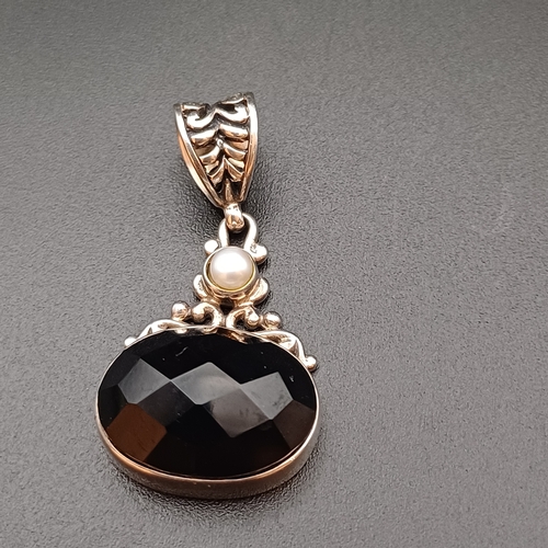 42 - Earring and Pendant set.  Black Stone/Onyx.  Really pretty.
- 925 silver