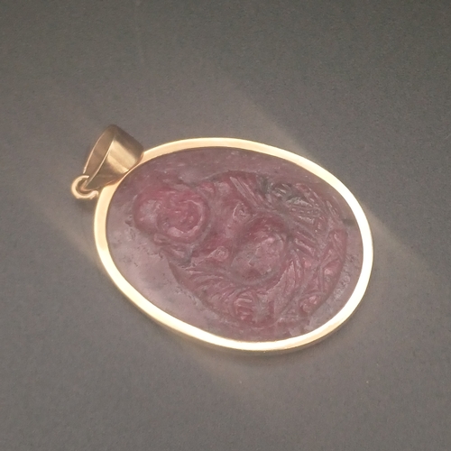 43 - Natural Carved Ruby Cameo set in 9 ct gold weighing 7.9 g