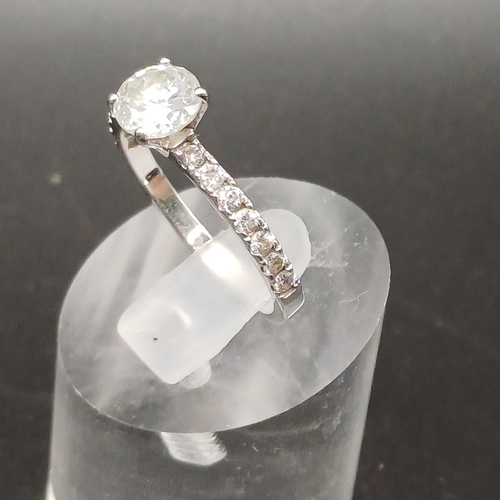 20 - Solitaire Diamond Ring with diamonds in shoulders set in 18 ct White Gold.
- size N
- weight 2.51g