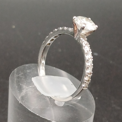 20 - Solitaire Diamond Ring with diamonds in shoulders set in 18 ct White Gold.
- size N
- weight 2.51g