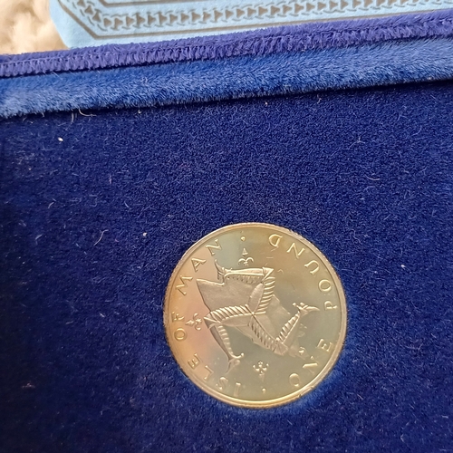 2 - Proof Isle of Man One Pound Coin boxed with Certificate
weighing 4.60 g with a press run of 75,000