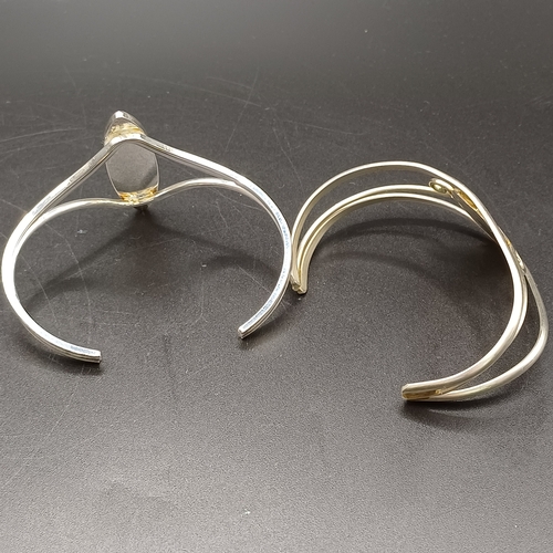 26 - Two lovely silver bangles
1. Silver metal (no hallmark) with Black Onyx detail - 22.46g
2. Silver me... 