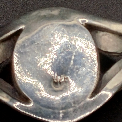 27 - Silver Bangle with Large Turquoise Stone inset with silver flower detail on the sides.    
- 925 Sil... 
