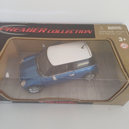 55 - Collection of Five Boxed Scale Model Cars: Triumph TR4 and Stag; Mini x 2; Jaguar E Cabriolet 1961