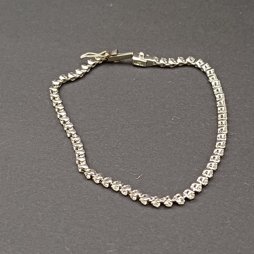 22 - Pretty Diamond Line Bracelet set in 18 carat white gold.  There is approximately 3 carat in total of... 