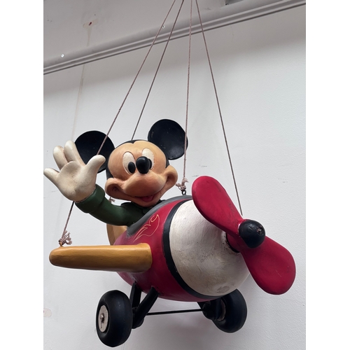 250 - Vintage Mickey Mouse Figurine in an airplane, likely 1980s. Approx 50 cm designed to be hung or surf...