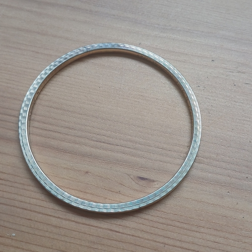 331 - Gold Bangle large/slave
- 9ct yellow gold
- 7g