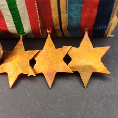 32 - Medal  bar consisting of Defence and Campaign Medals together with Three Stars World War II, Italy a... 