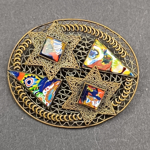 4 - Three pretty brooches each with different stones set in and all very striking.