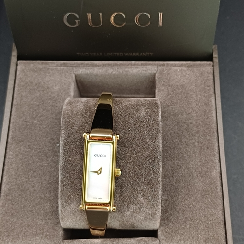 18 - Pair of Gucci Ladies Watches, both boxed with paperwork:
1.  Gucci 6800L - Silver Metal Face and Ban... 