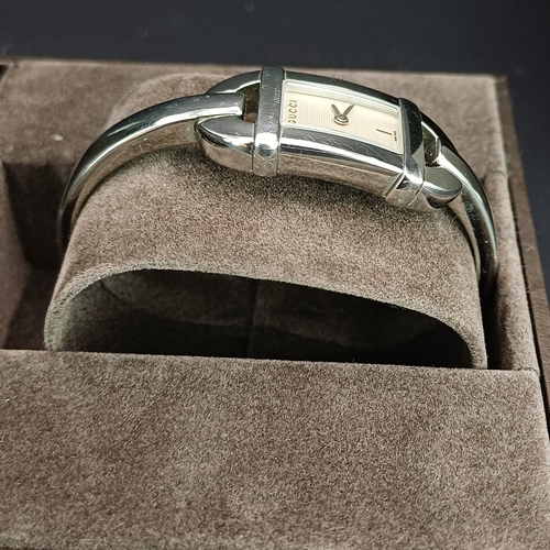 18 - Pair of Gucci Ladies Watches, both boxed with paperwork:
1.  Gucci 6800L - Silver Metal Face and Ban... 