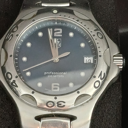 24 - TAG Heuer Professional WL111F TT5456 .  A 37mm case houses a quartz movement and features a bule dia... 