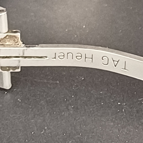 24 - TAG Heuer Professional WL111F TT5456 .  A 37mm case houses a quartz movement and features a bule dia... 