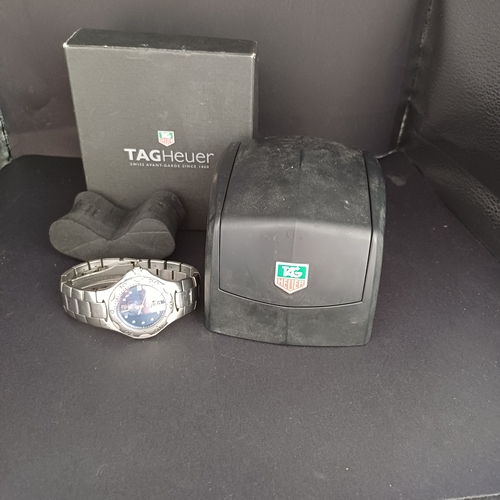 24 - TAG Heuer Professional WL111F TT5456 .  A 37mm case houses a quartz movement and features a bule dia... 