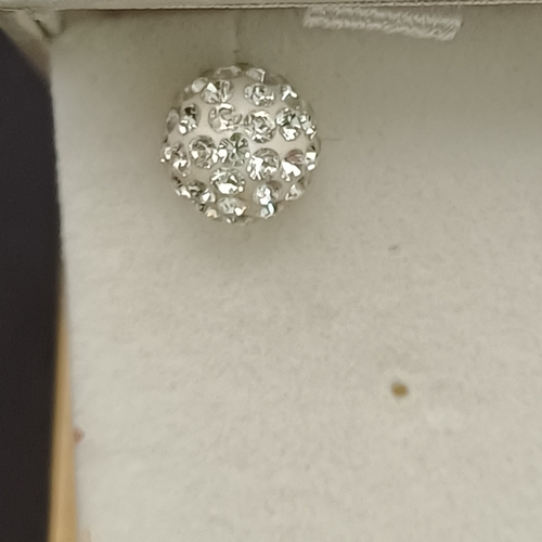 32 - Pair of Swarovski Crystallized Stud earrings set on 9 carat white gold.