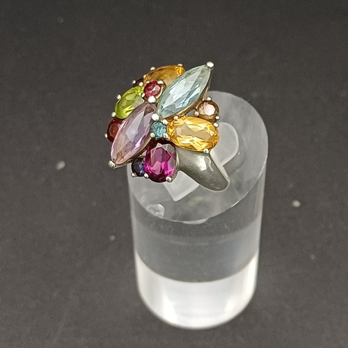 55 - Multi Gem Stone Ring set into 925 Silver.  This looks absolutely stunning on and not too large for s... 
