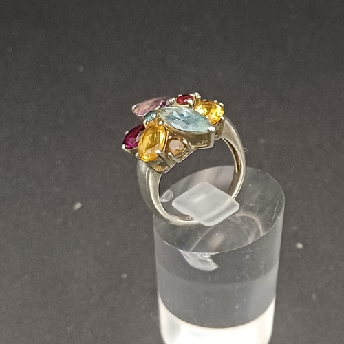 55 - Multi Gem Stone Ring set into 925 Silver.  This looks absolutely stunning on and not too large for s... 