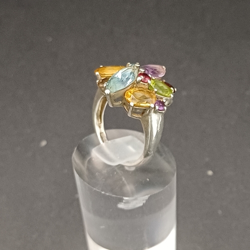 55 - Multi Gem Stone Ring set into 925 Silver.  This looks absolutely stunning on and not too large for s... 