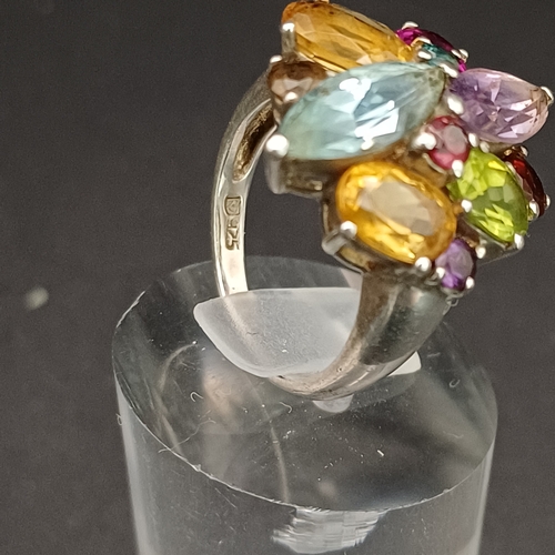 55 - Multi Gem Stone Ring set into 925 Silver.  This looks absolutely stunning on and not too large for s... 