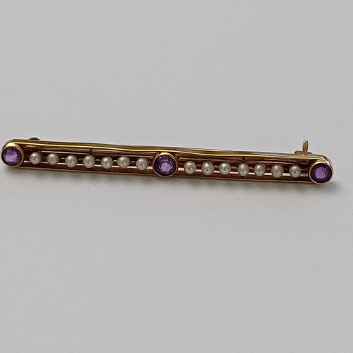 57 - Edwardian Amethyst and Seed Pearl Pin Brooch set into 14 carat yellow gold weighing 2.90g.