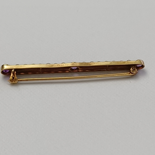 57 - Edwardian Amethyst and Seed Pearl Pin Brooch set into 14 carat yellow gold weighing 2.90g.