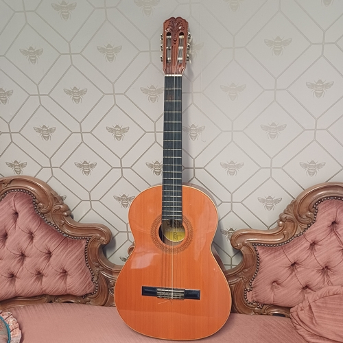 105 - Concert Grande Spanish Classical Guitar by BM of Spain.  This has a really beautiful sound in excell... 