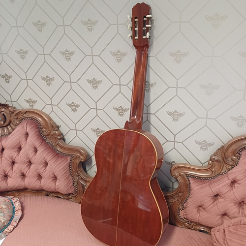 105 - Concert Grande Spanish Classical Guitar by BM of Spain.  This has a really beautiful sound in excell... 