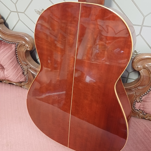 105 - Concert Grande Spanish Classical Guitar by BM of Spain.  This has a really beautiful sound in excell... 