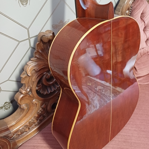105 - Concert Grande Spanish Classical Guitar by BM of Spain.  This has a really beautiful sound in excell... 