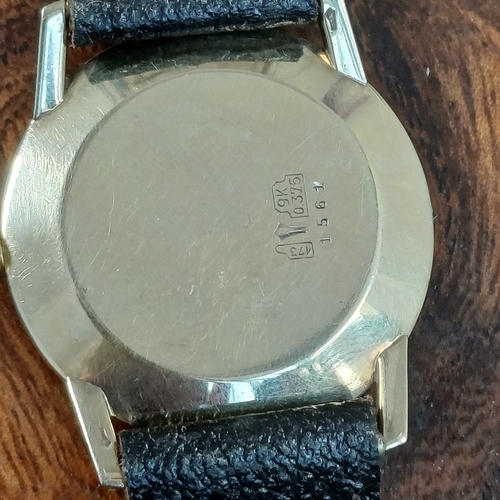 70 - Baume Gents 9 carat gold watch.  This has just been serviced.  This is in working order and in very ... 