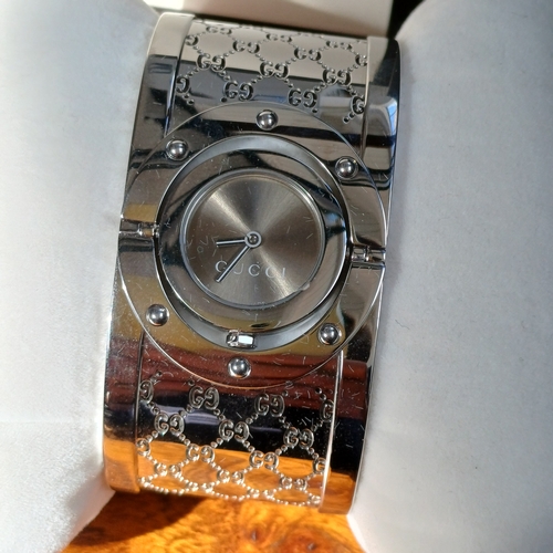 72 - Ladies Gucci Twirl Bangle Watch.  This is in excellent condition and all boxed with paperwork.
