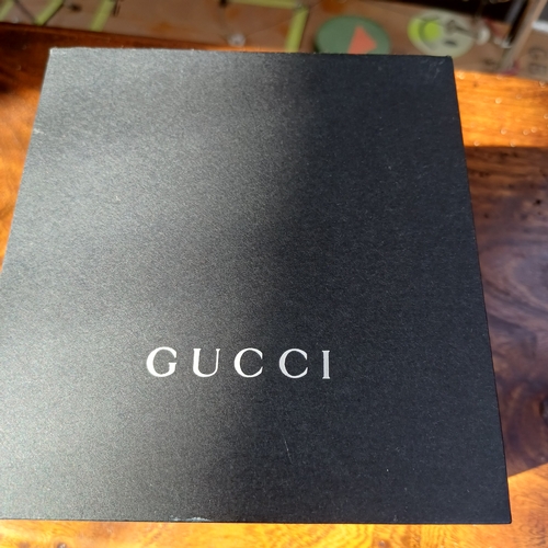 72 - Ladies Gucci Twirl Bangle Watch.  This is in excellent condition and all boxed with paperwork.