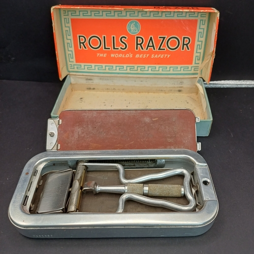81 - Rolls Razor boxed and in excellent condition.  This product was a type of safety razor known for its... 