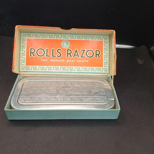 81 - Rolls Razor boxed and in excellent condition.  This product was a type of safety razor known for its... 