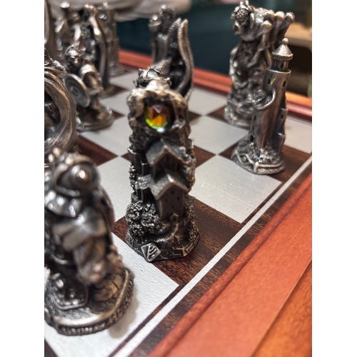 185 - This stunning Lord of the rings chess set by Danbury Mint in pewter and Swarovski crystal. 
Rare fin... 