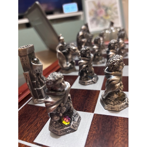 185 - This stunning Lord of the rings chess set by Danbury Mint in pewter and Swarovski crystal. 
Rare fin... 