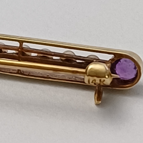 11 - Edwardian Amethyst and Seed Pearl Pin Brooch set into 14 carat yellow gold weighing 2.90g.