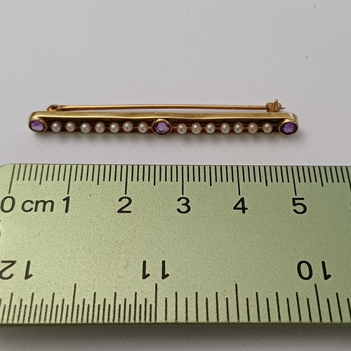 11 - Edwardian Amethyst and Seed Pearl Pin Brooch set into 14 carat yellow gold weighing 2.90g.