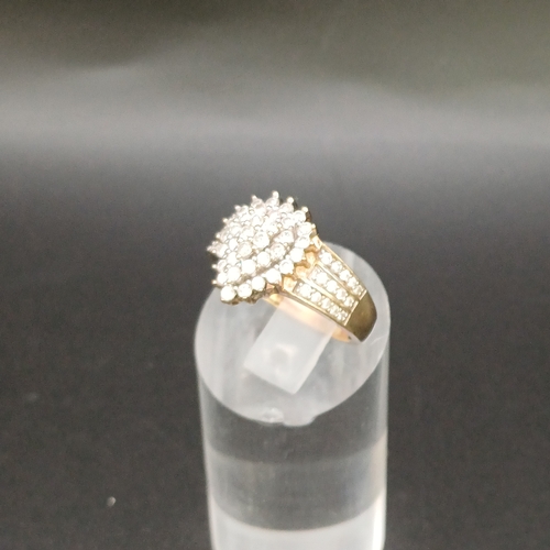 24 - Diamond Cluster Ring in a heart shape design with diamond set shoulders.
- 9 carat yellow gold
- wei... 