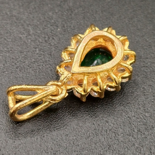 26 - Very pretty Pear Shaped Emerald set in 18 carat yellow gold with white stones set around weighing 3.... 