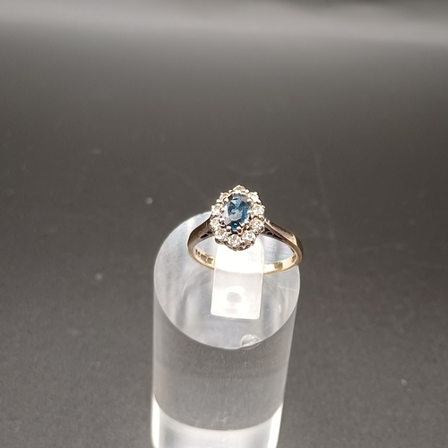33 - Blue and White Sapphire cluster ring set in 9 carat yellow gold.
- weight 2.42g
- size K