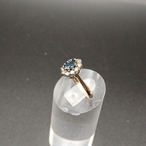 33 - Blue and White Sapphire cluster ring set in 9 carat yellow gold.
- weight 2.42g
- size K