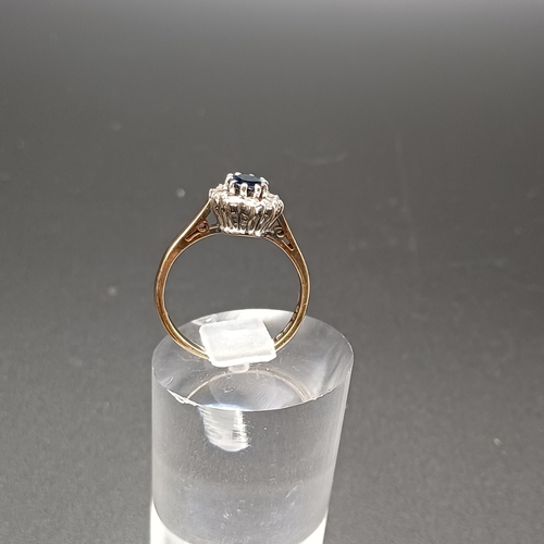 33 - Blue and White Sapphire cluster ring set in 9 carat yellow gold.
- weight 2.42g
- size K