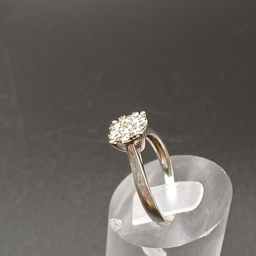 34 - Diamond Cluster Ring set in 9 carat white gold.
- weight 2.5g
- size M
- diamond carat weight 0.50