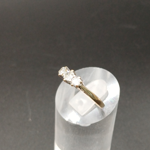 35 - Three Stone Diamond Ring set in 9 carat yellow gold.  
- weight 2g
- size O